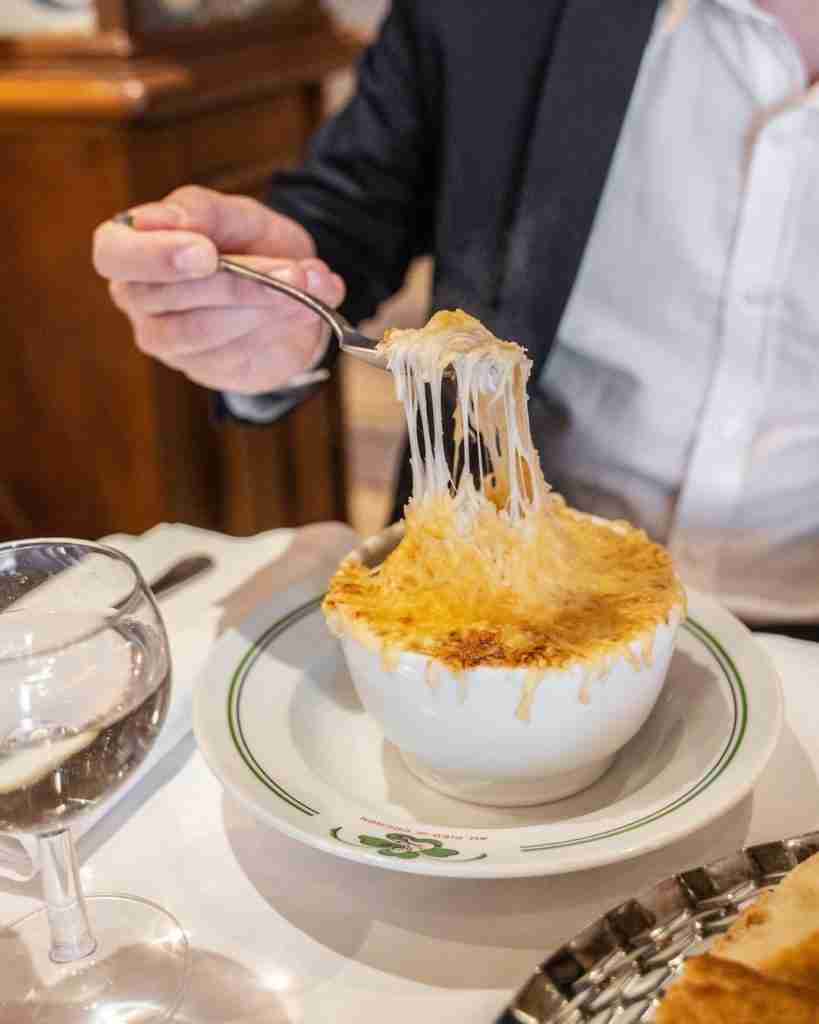 French onion soup from Au Pied de Cochon is among the best in Paris/courtesy of Au Pied de Cochon/Facebook page