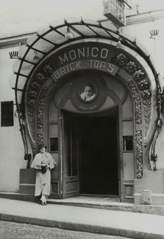 Ada standing in front of her club, Chez Brick Top’s, sometime in the 1920s. Schomburg Center for Research in Black Culture, Photographs and Prints Division, The New York Public Library. (1920 - 1960).